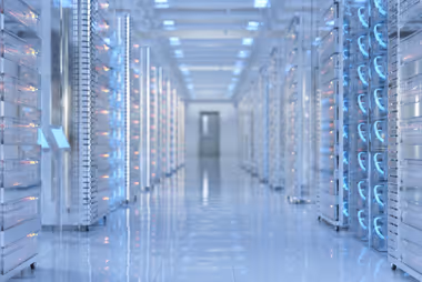 Professional technology workspace showing modern computers and networking equipment used for cybersecurity and IT consulting services